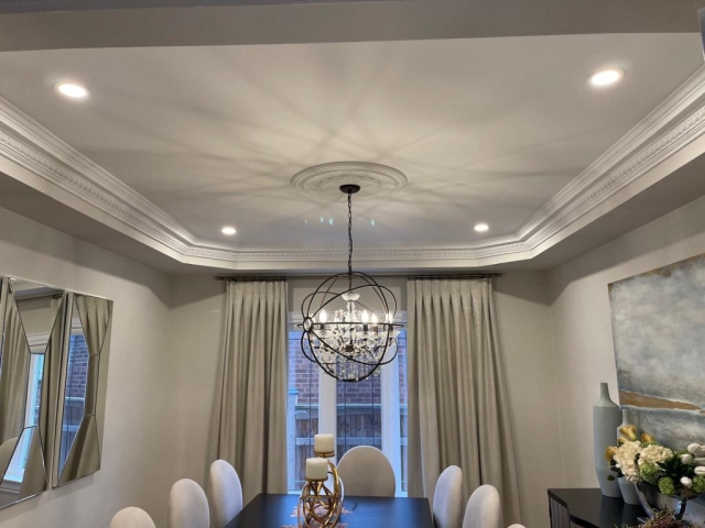 Custom home dining room lighting design featuring a designer chandelier wired by a licensed ACS electrician in North York.